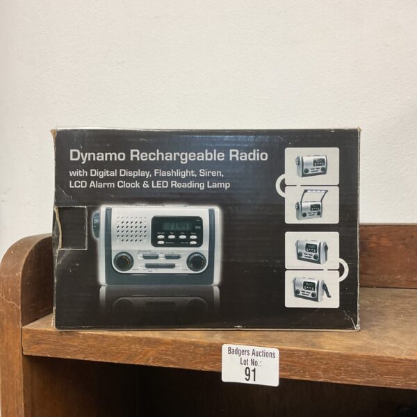 Vintage dynamo rechargeable radio with flashlight and digital display.