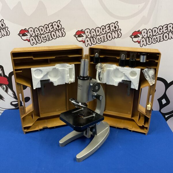 Vintage Olympus Tokyo microscope in its original carrying case.