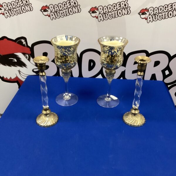 Set of four ornate vintage candle holders with twisted glass.
