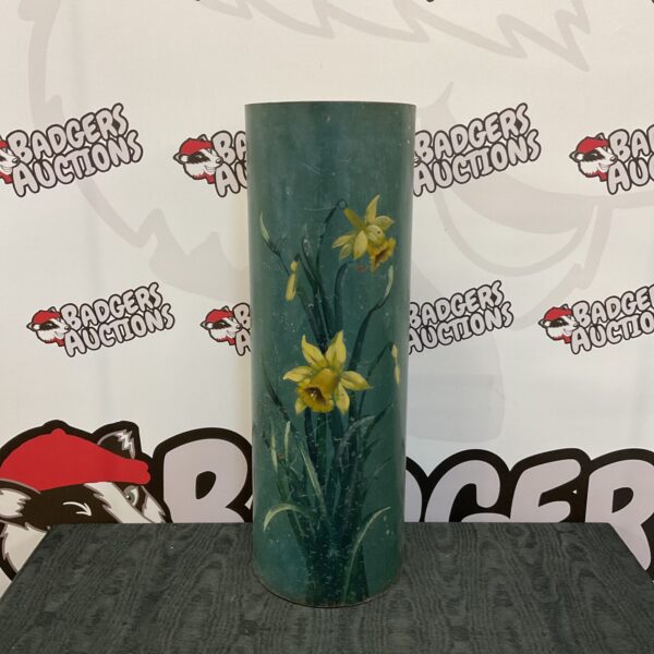 Vintage enamel stick stand with vibrant daffodil design for hallway decor.