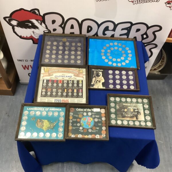 Mounted coin collection displaying historical commemorative coins.