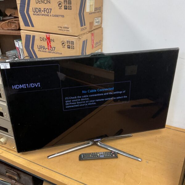 Samsung 40 inch smart TV with remote control for home entertainment.