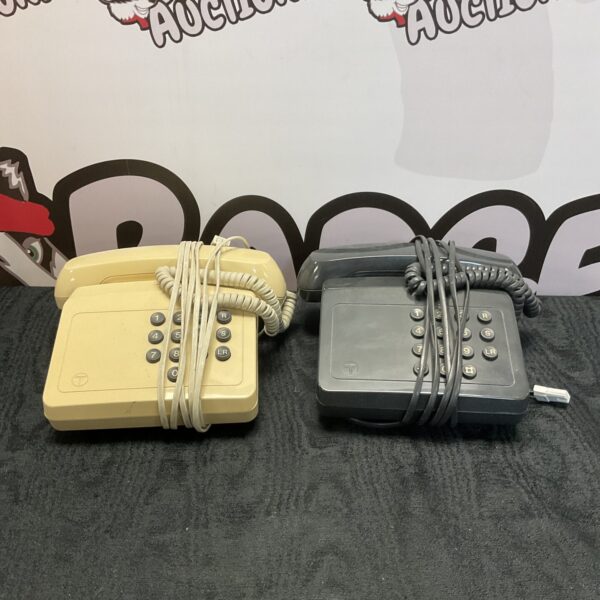 Pair of vintage British Telecom push button telephones, retro design.