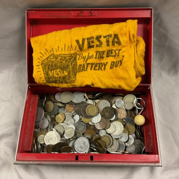 Red cash tin filled with a lot of assorted vintage coins.