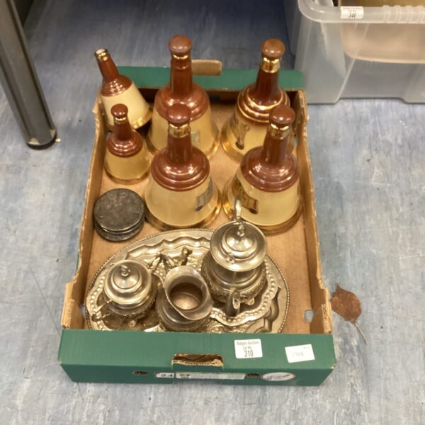 Vintage Bells pottery bottles and silverplate coffee set on display.