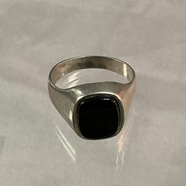 Silver signet ring with black onyx stone.
