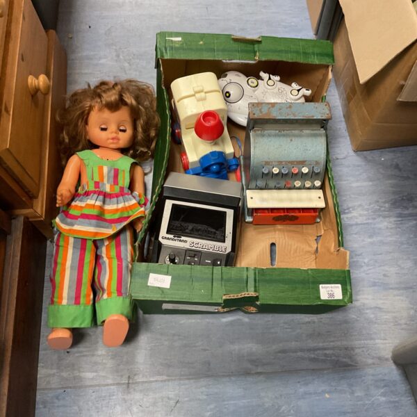 Vintage cash register and doll in a mixed toy lot.
