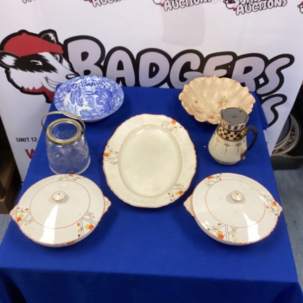 Vintage terrines and Spode bowl collection on display.