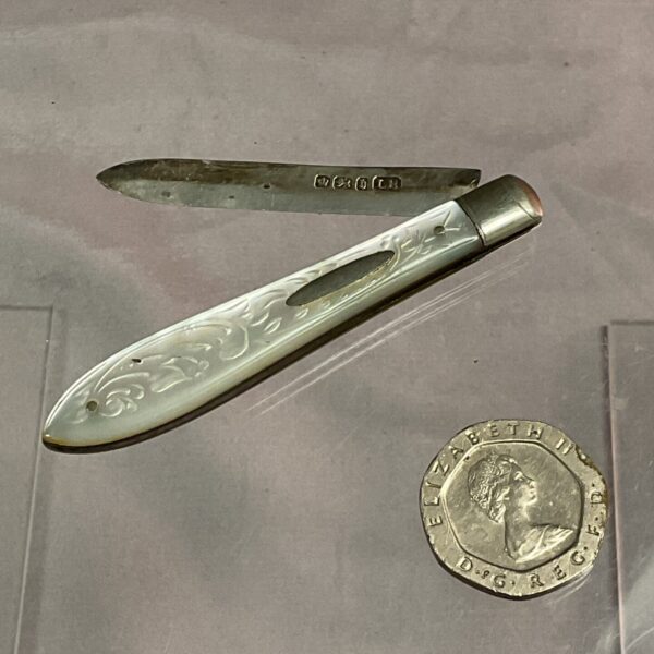 Antique silver fruit knife with mother of pearl handle.