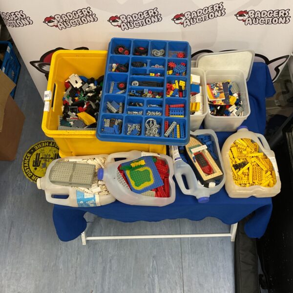 Large job lot of vintage Lego building blocks in a container.