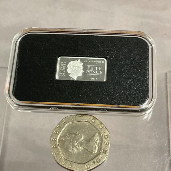 Silver ingot commemorating the Battle of Hastings, presented in a protective slab.