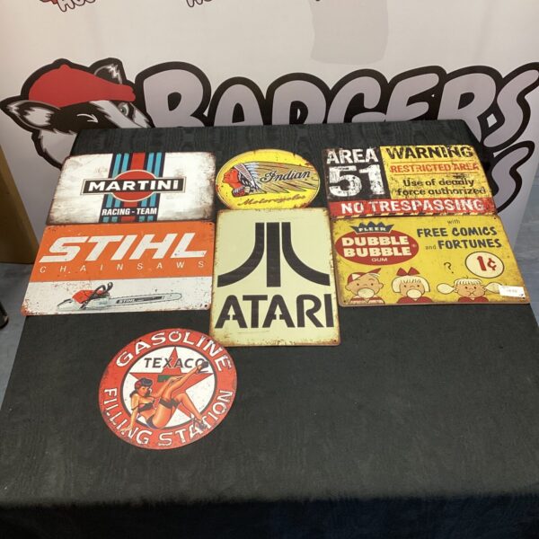Vintage advertising signs lot including Atari, Texaco, and Martini brands.