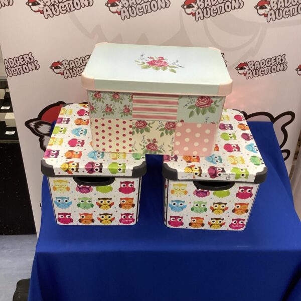 Set of three patterned Curver storage boxes for home organisation.