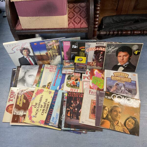 Vintage vinyl record and cassette tape collection featuring David Essex and Cliff Richard.