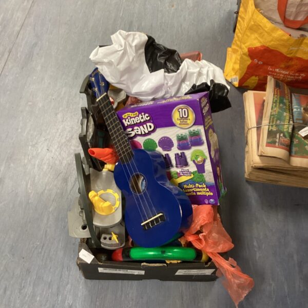Brightly coloured guitar in a mixed toy lot.