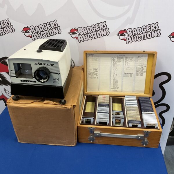 Vintage Gnome 744 slide projector with wooden case of slides.