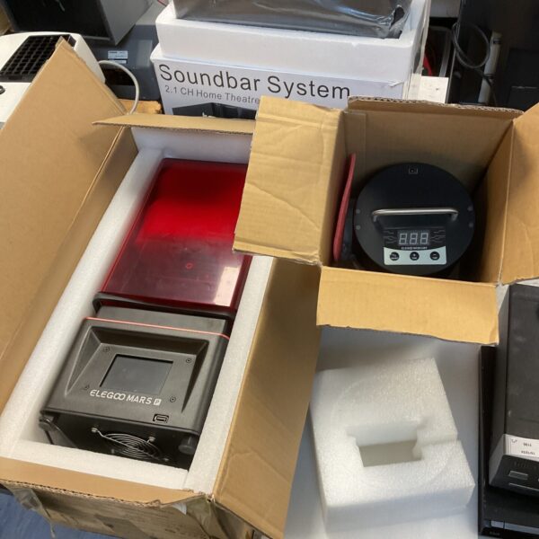Elegoo Mars 3D printer and curing box in original packaging.