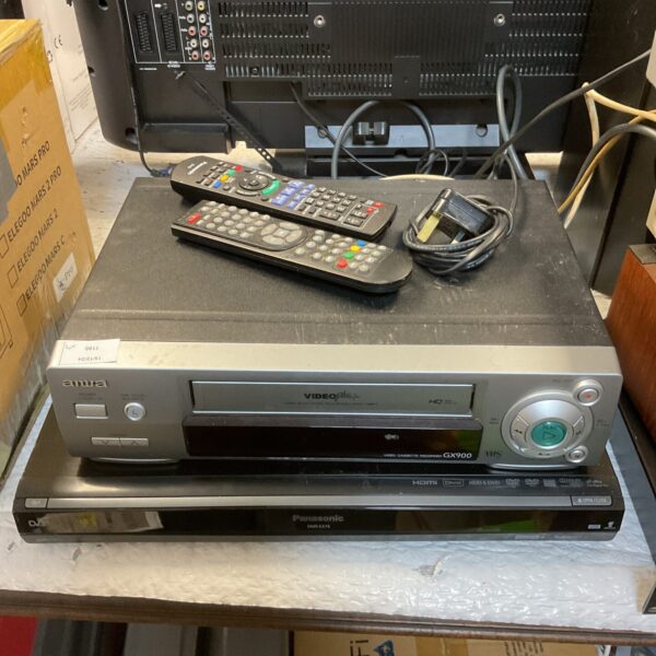 Vintage Aiwa GX900 VHS recorder and Panasonic DVD player, retro video equipment.