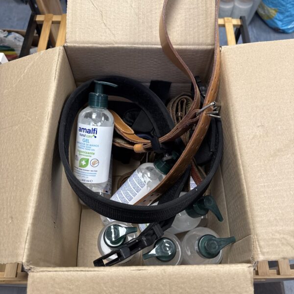 Hand sanitiser bottles and assorted belts in a mixed lot.