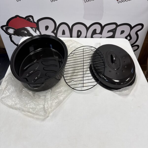 Black oval grill pan with grate insert.