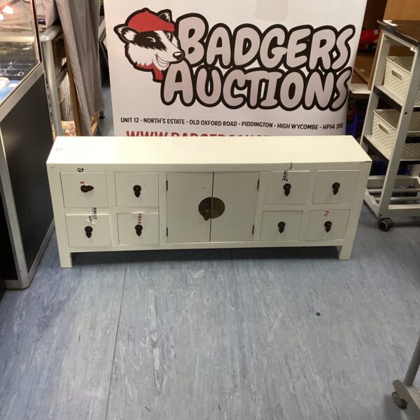 White storage unit for sale at auction.