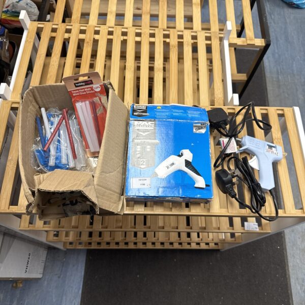 Two glue guns with glue sticks, including a Mac Allister model.
