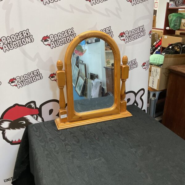 Vintage pine dressing table mirror with curved supports.