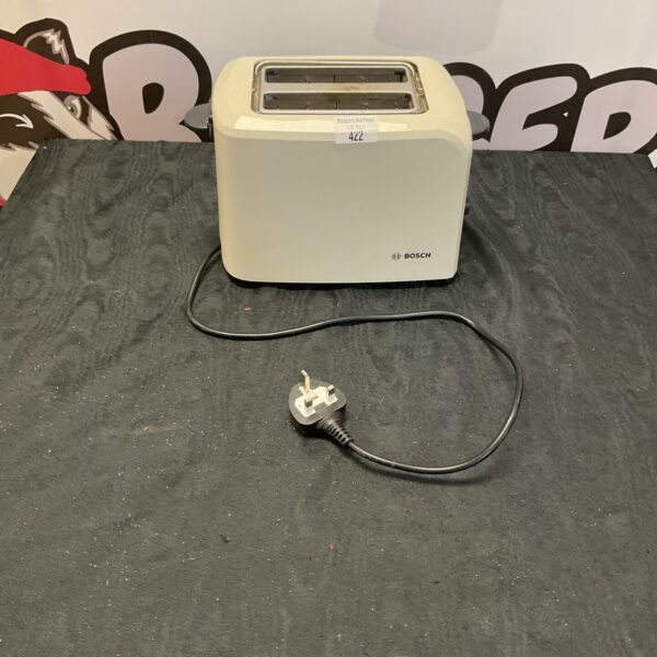 Used Bosch toaster on a dark surface, kitchen appliance.