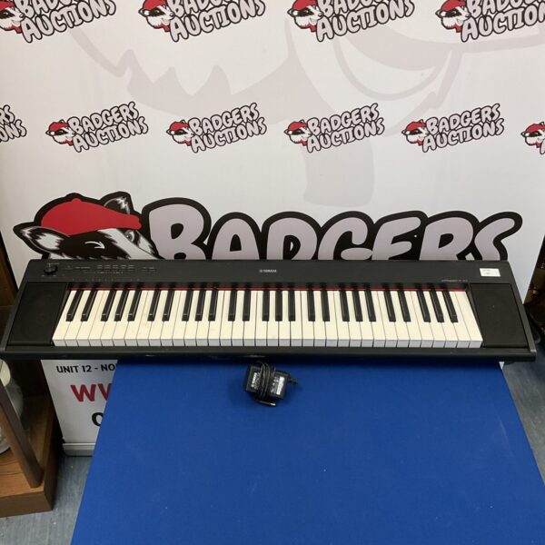 Yamaha Piaggero NP-12 keyboard in used condition, showing the keys and controls.