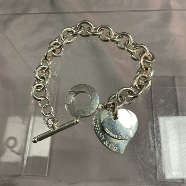 Vintage silver tone Tiffany style bracelet with heart charm.
