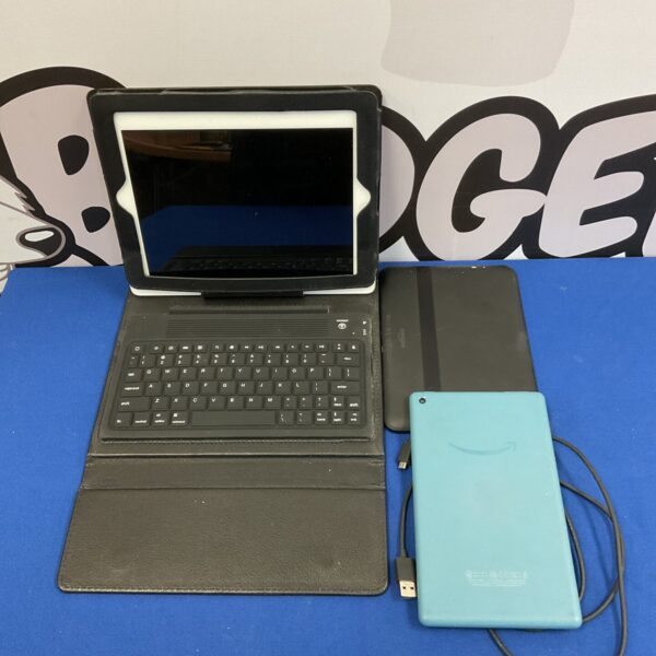 Apple iPad with keyboard, showing signs of wear.