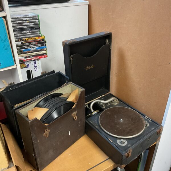 Vintage Pedola gramophone with two cases of records.