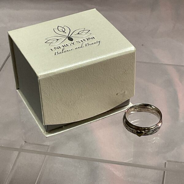 Sterling silver spinner ring with heart design, size T.