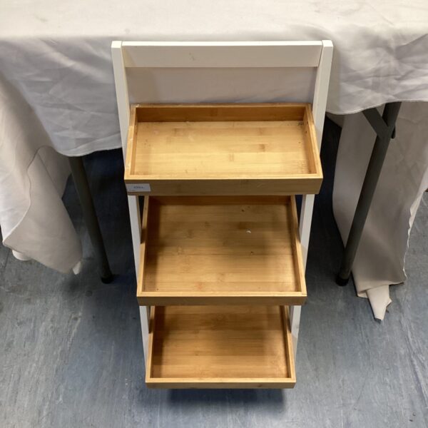 White and wood three-tiered vegetable rack for kitchen storage.