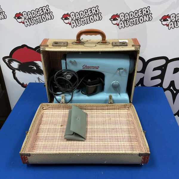 Vintage Chapman Gloria electric sewing machine in carrying case.