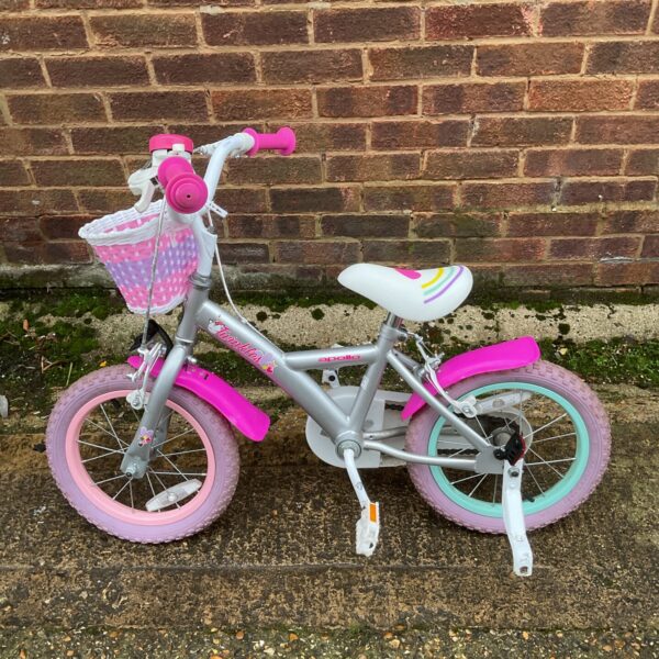Pink Apollo Twinkles child's bike with basket.