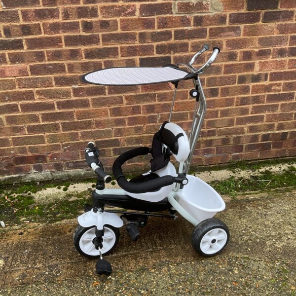 Blue and white Malatec kids trike for toddlers learning to ride.