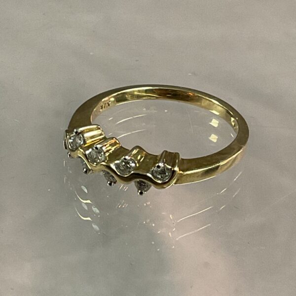 Close-up of a 9ct gold diamond ring, size P.