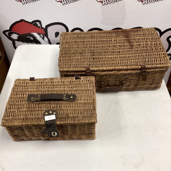 Pair of vintage wicker baskets for storage and display.