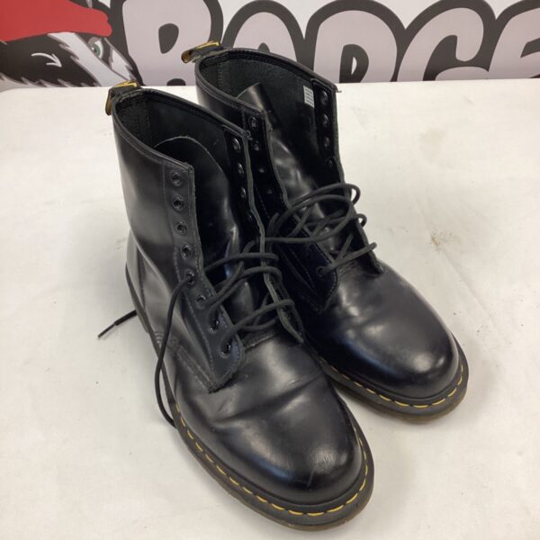 Black leather Dr Martens size 11 boots with yellow stitching.