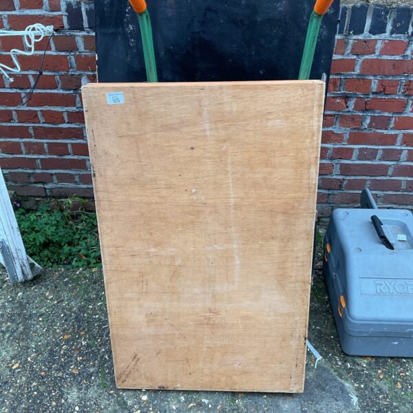 Vintage wooden folding pasting table for crafting and DIY projects.