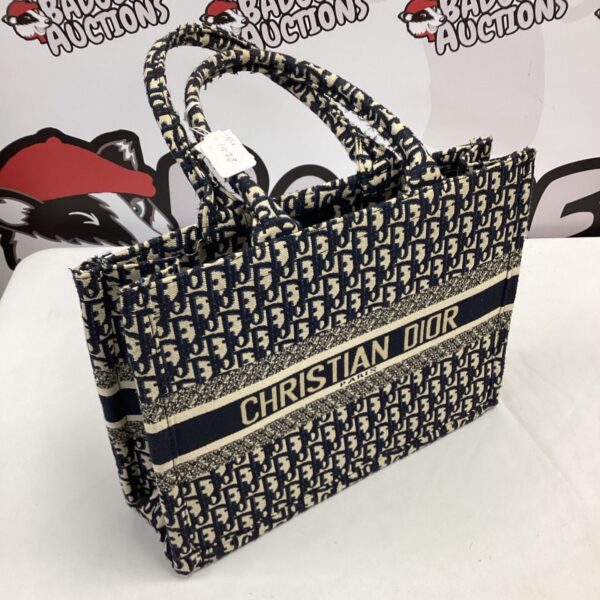 Christian Dior style handbag, patterned tote bag, fashion accessory.