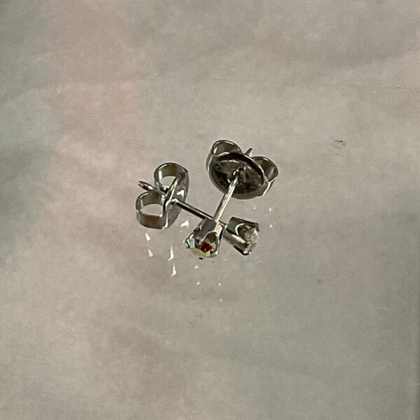 Close-up of 9ct white gold stud earrings, showcasing their elegant design.