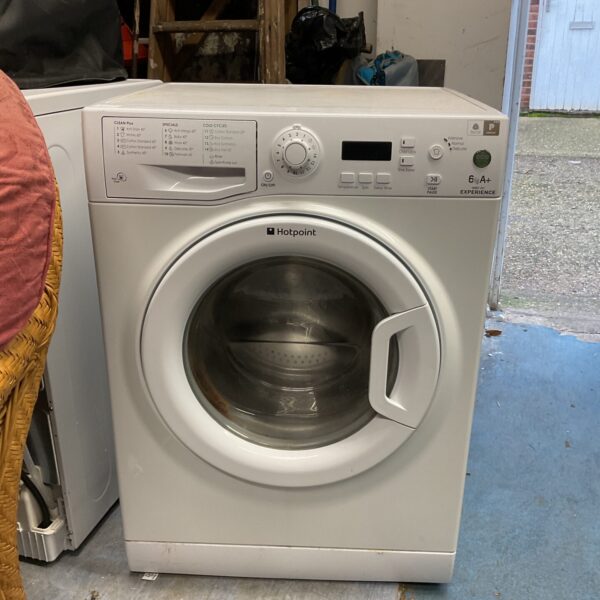 White Hotpoint 6kg washing machine, front view, used condition.