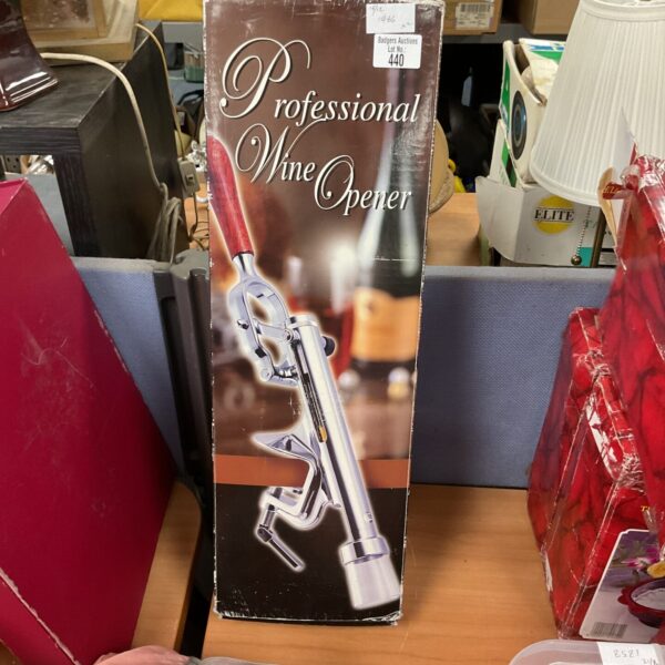 Vintage professional wine opener with lever mechanism.