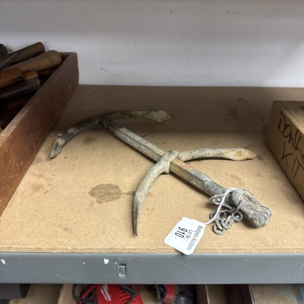 Antique double hook boat anchor, weathered and rustic.