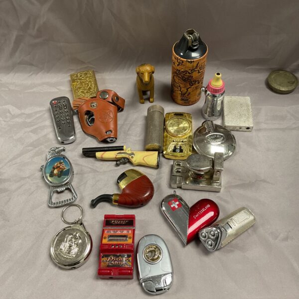 Overview of a vintage novelty lighters collection, featuring diverse designs.