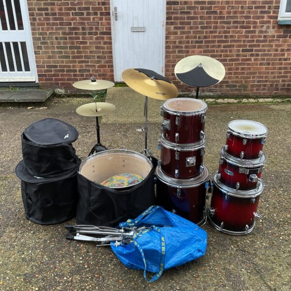 Red Mapex 7-piece drum kit with cymbals and hardware.