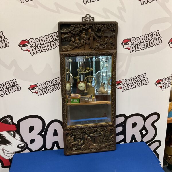 Antique Chinese carved wood mirror with bevel edge.
