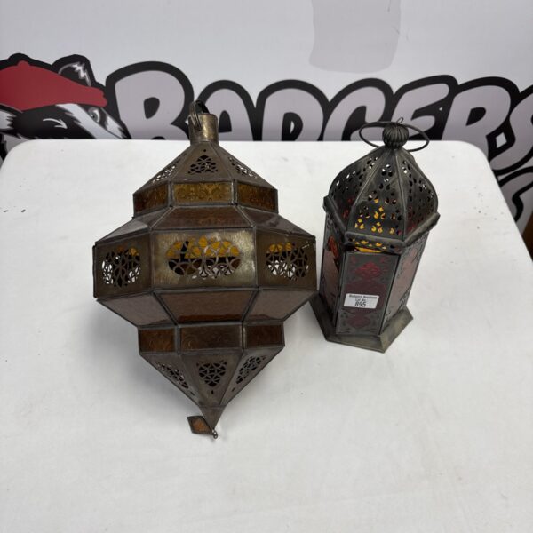 Pair of vintage oriental lanterns with intricate metalwork.